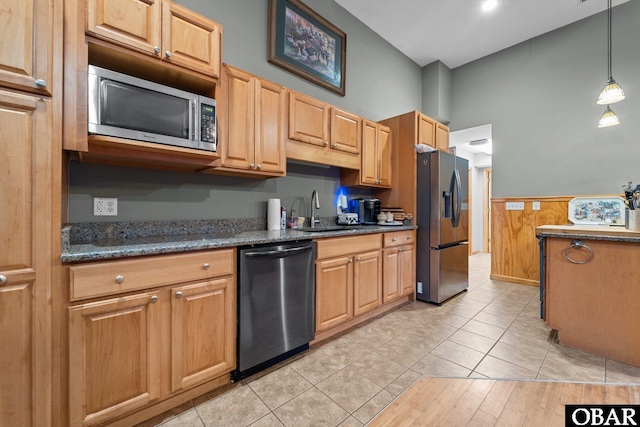 117 Cliffs Of Colington Trl Lot 5, Kill Devil Hills, NC 27948 - kitchen featuring dark stone countertops, hanging light fixtures, a sink, wainscoting, and stainless steel appliances