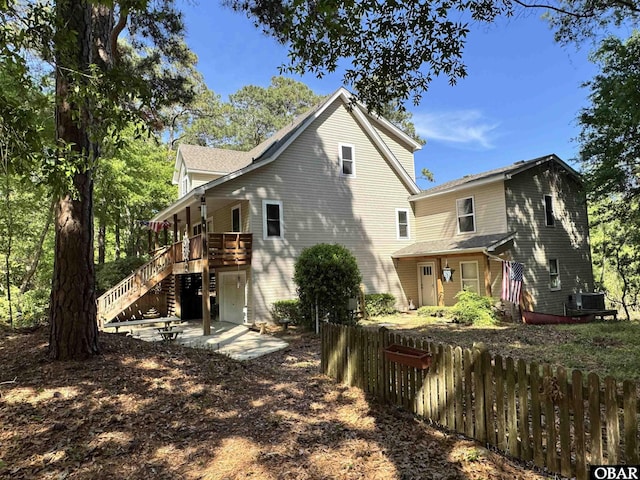 117 Cliffs Of Colington Trl Lot 5, Kill Devil Hills, NC 27948 - back of property with stairway, fence, and cooling unit