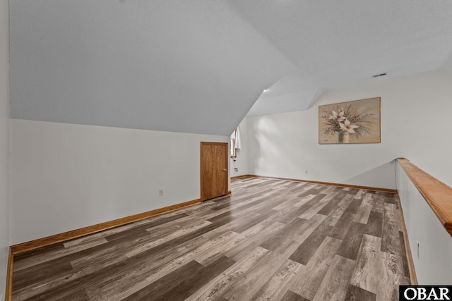 117 Cliffs Of Colington Trl Lot 5, Kill Devil Hills, NC 27948 - bonus room featuring vaulted ceiling, wood finished floors, and baseboards