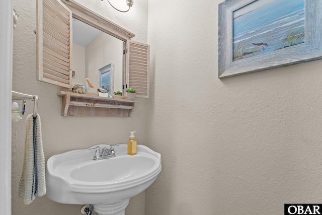 126 W Waterside Ln Lot 25, Nags Head, NC 27959 - bathroom with a sink and a textured wall