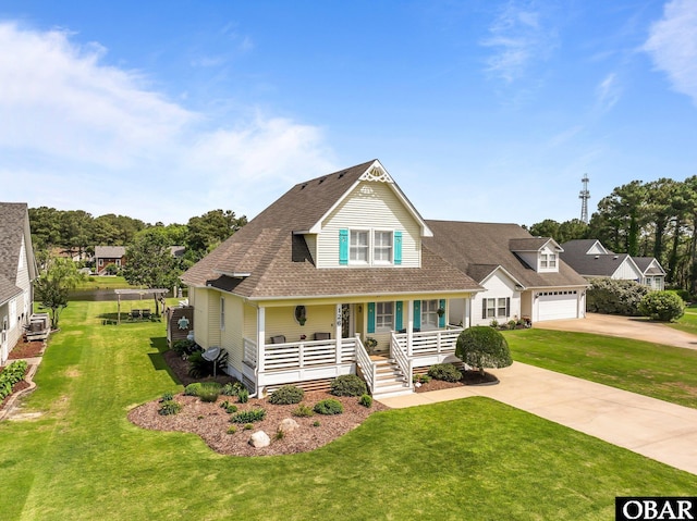 126 W Waterside Ln Lot 25, Nags Head, NC 27959 - view of front of home featuring covered porch, driveway, a front lawn, and a shingled roof