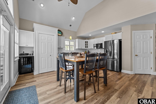 126 W Waterside Ln Lot 25, Nags Head, NC 27959 - dining space with a ceiling fan, high vaulted ceiling, light wood finished floors, recessed lighting, and baseboards