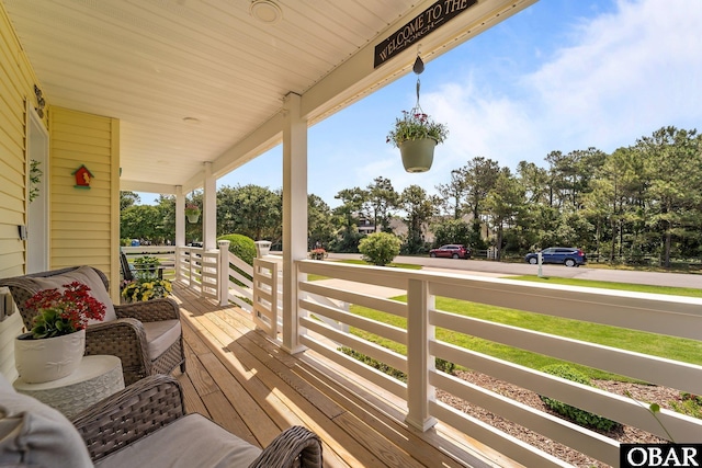 126 W Waterside Ln Lot 25, Nags Head, NC 27959 - wooden porch with view of scattered trees