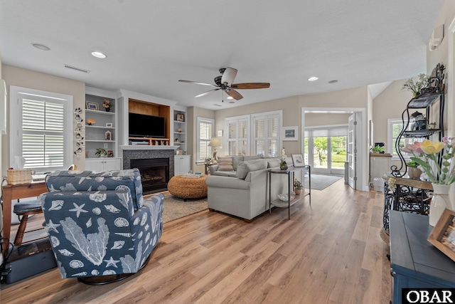 126 W Waterside Ln Lot 25, Nags Head, NC 27959 - living room with light wood-type flooring, a fireplace, a ceiling fan, and recessed lighting