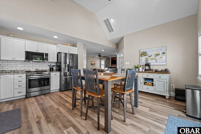 126 W Waterside Ln Lot 25, Nags Head, NC 27959 - dining room with a ceiling fan, light wood-style floors, high vaulted ceiling, and recessed lighting