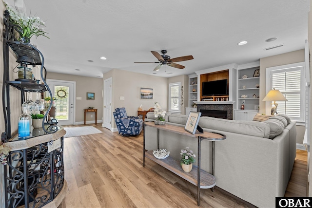 126 W Waterside Ln Lot 25, Nags Head, NC 27959 - living area featuring a ceiling fan, a fireplace, light wood finished floors, baseboards, and recessed lighting