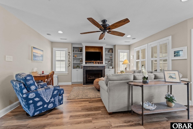 126 W Waterside Ln Lot 25, Nags Head, NC 27959 - living room featuring baseboards, ceiling fan, a fireplace, wood finished floors, and recessed lighting