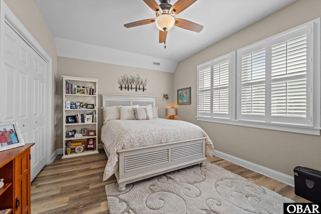126 W Waterside Ln Lot 25, Nags Head, NC 27959 - bedroom with baseboards, wood finished floors, a closet, a ceiling fan, and vaulted ceiling