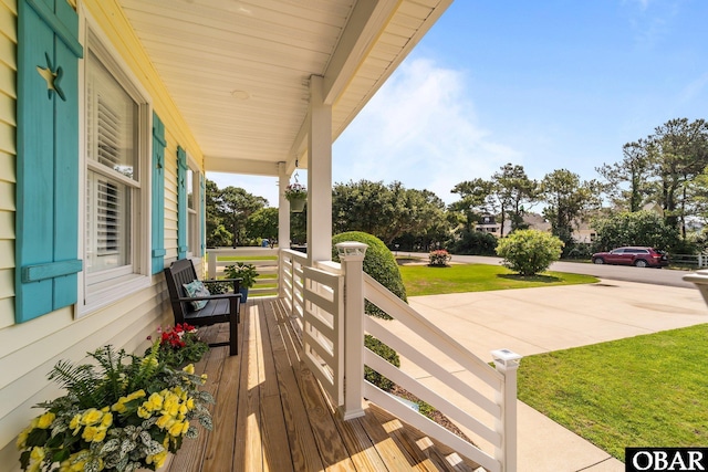 126 W Waterside Ln Lot 25, Nags Head, NC 27959 - wooden porch with a yard