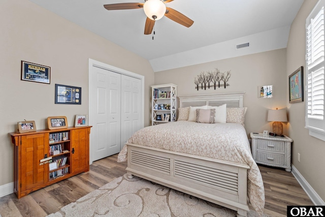 126 W Waterside Ln Lot 25, Nags Head, NC 27959 - bedroom with light wood-style floors, multiple windows, and a closet