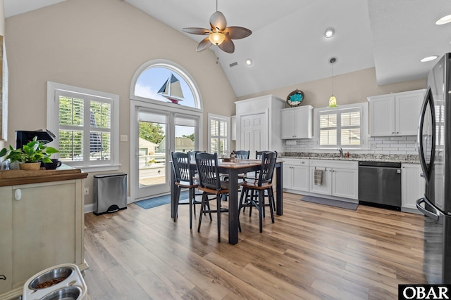 126 W Waterside Ln Lot 25, Nags Head, NC 27959 - dining space with ceiling fan, high vaulted ceiling, light wood-style flooring, plenty of natural light, and recessed lighting