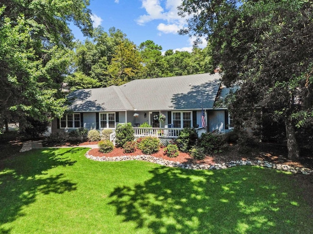 single story home featuring a front yard and covered porch