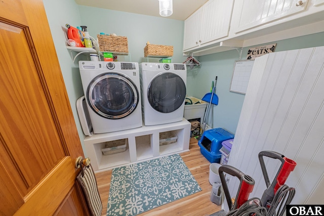 50084 Freebooter Ct Lot 177, Frisco, NC 27936 - laundry area featuring washing machine and clothes dryer, cabinet space, and light wood finished floors