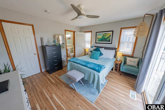 50084 Freebooter Ct Lot 177, Frisco, NC 27936 - bedroom with light wood-style flooring, ensuite bathroom, and a ceiling fan