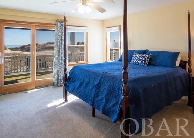 bedroom featuring a ceiling fan, access to outside, and carpet flooring