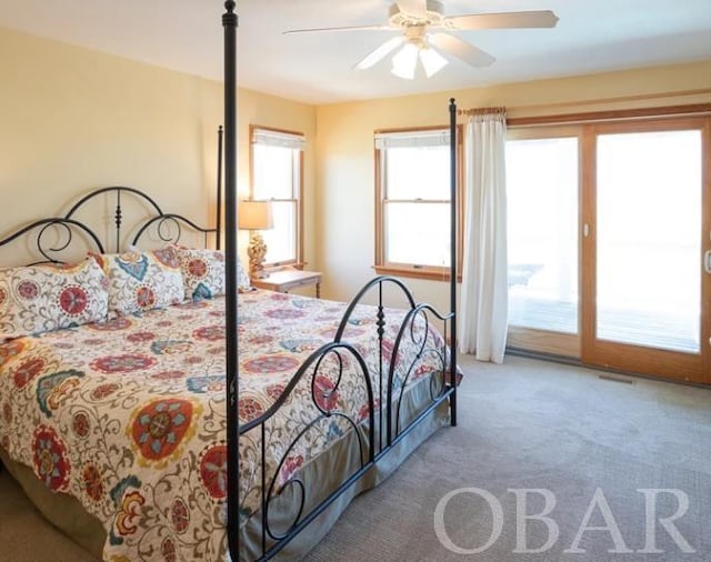 bedroom featuring carpet floors, access to outside, and ceiling fan