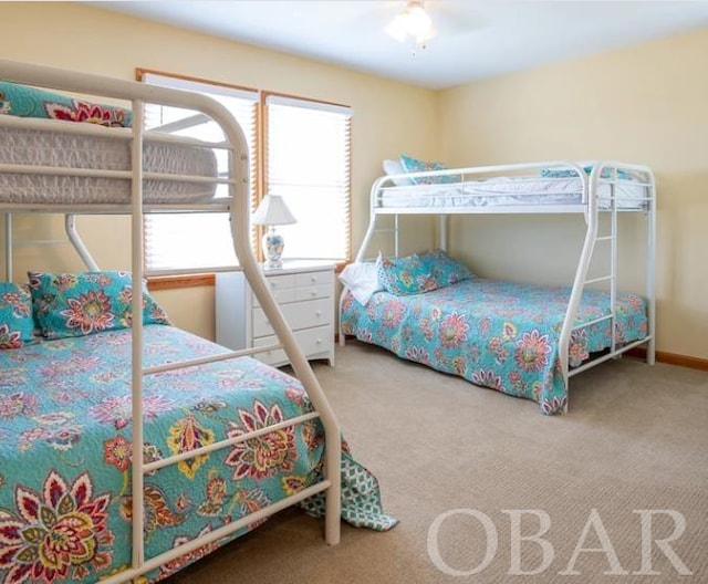 bedroom with ceiling fan and carpet