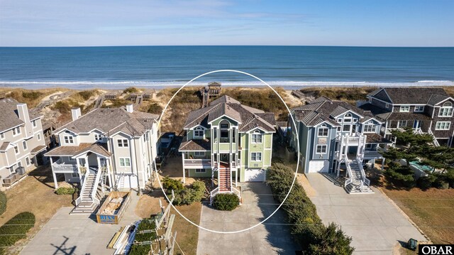 aerial view featuring a water view and a residential view