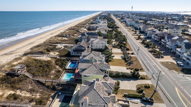 bird's eye view with a beach view, a residential view, and a water view