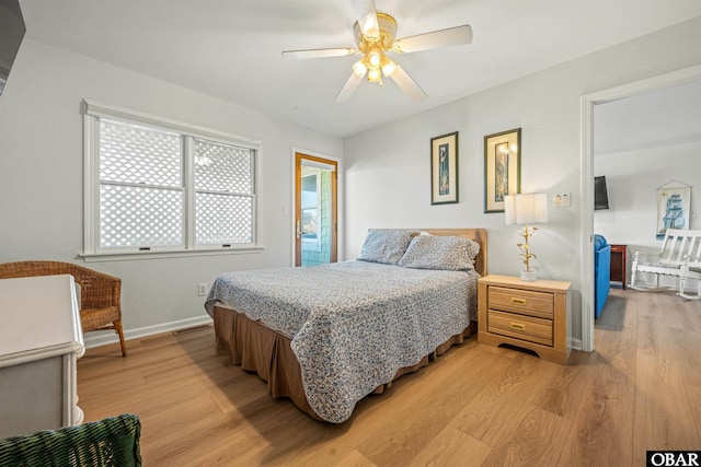 bedroom featuring visible vents, a ceiling fan, light wood-style flooring, and baseboards