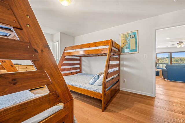 bedroom featuring light wood-type flooring and baseboards