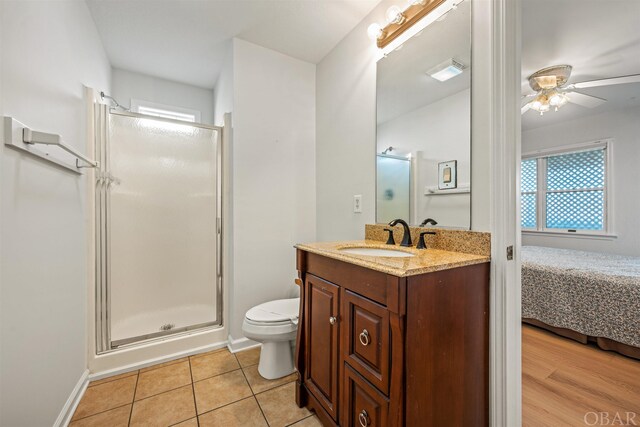 ensuite bathroom featuring visible vents, toilet, ensuite bathroom, tile patterned flooring, and vanity