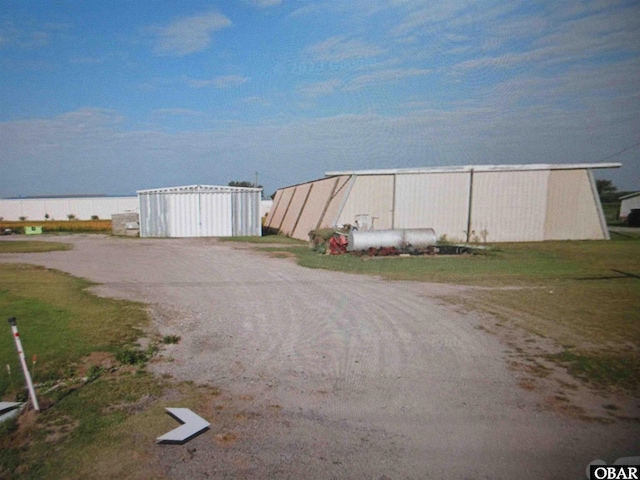 view of road with an outbuilding