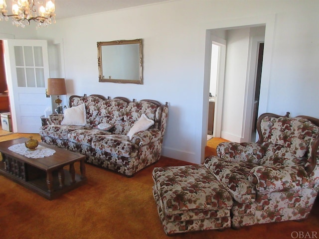 carpeted living area featuring an inviting chandelier