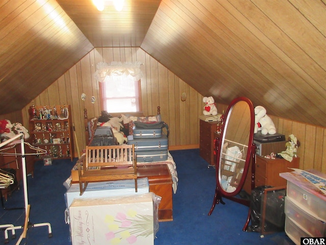 bedroom with lofted ceiling, dark colored carpet, wood ceiling, and wooden walls