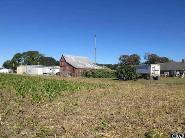 view of yard featuring a barn and an outdoor structure