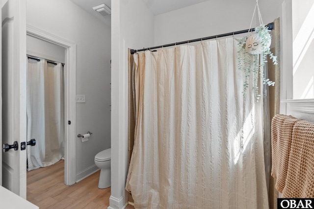 37 Foxwood Cir Lot # 33, Southern Shores, NC 27949 - full bath featuring wood finished floors, toilet, and baseboards