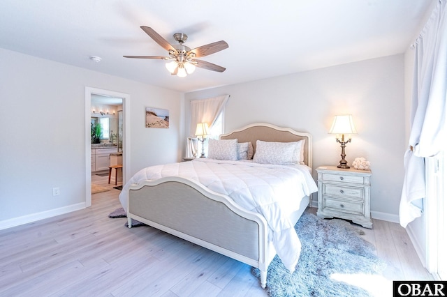 bedroom with light wood-style flooring, baseboards, ceiling fan, and ensuite bathroom