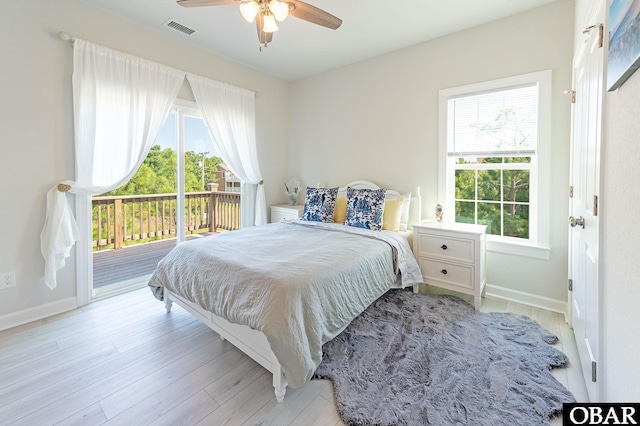 bedroom featuring access to exterior, baseboards, visible vents, and light wood-style floors