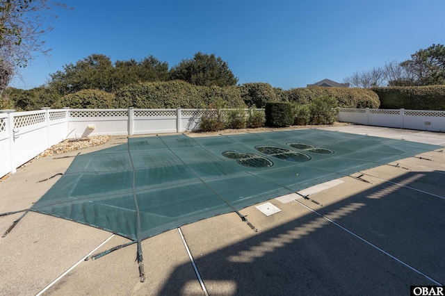 view of pool featuring a fenced backyard, a fenced in pool, and a patio