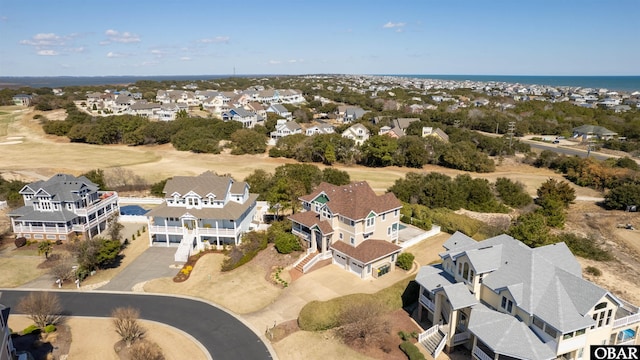 birds eye view of property with a residential view