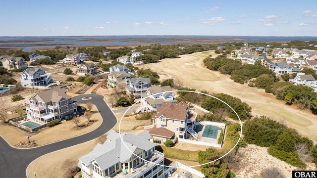 birds eye view of property with a residential view