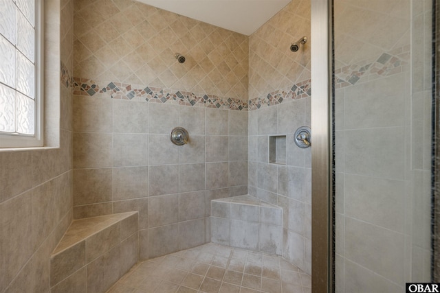 full bathroom with a tile shower