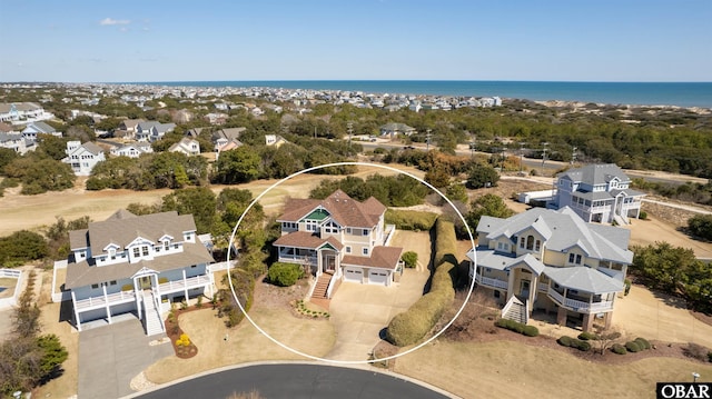 aerial view featuring a water view and a residential view