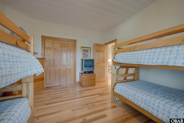 bedroom featuring a closet and wood finished floors