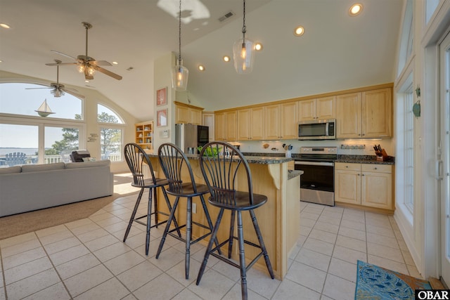 1278 Bear Foot Path Lot 250, Corolla, NC 27927 - kitchen with stainless steel appliances, light brown cabinets, light tile patterned flooring, high vaulted ceiling, and ceiling fan