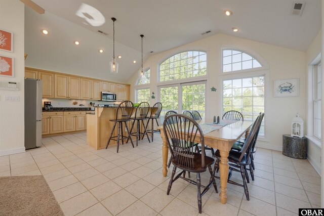 1278 Bear Foot Path Lot 250, Corolla, NC 27927 - dining area with light tile patterned floors, recessed lighting, high vaulted ceiling, and baseboards