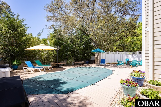 830 Hunt Club Dr Lot 387R, Corolla, NC 27927 - view of swimming pool featuring a fenced in pool, a wooden deck, a fenced backyard, and a patio