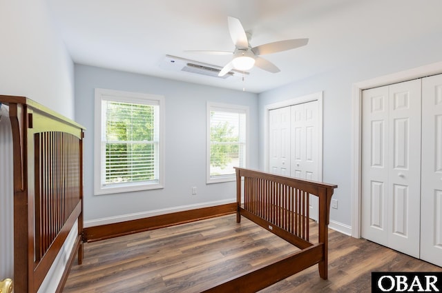 830 Hunt Club Dr Lot 387R, Corolla, NC 27927 - bedroom featuring wood finished floors, baseboards, ceiling fan, and two closets