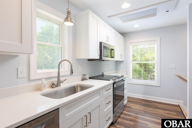 830 Hunt Club Dr Lot 387R, Corolla, NC 27927 - kitchen with stainless steel appliances, plenty of natural light, a sink, and white cabinetry