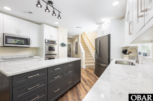 830 Hunt Club Dr Lot 387R, Corolla, NC 27927 - kitchen featuring a sink, stainless steel appliances, white cabinetry, dark wood-type flooring, and visible vents