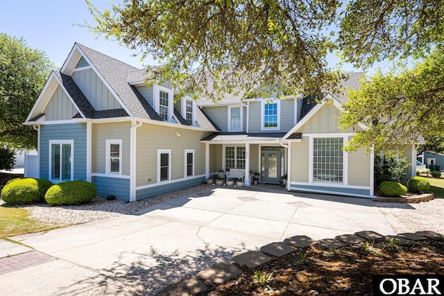 830 Hunt Club Dr Lot 387R, Corolla, NC 27927 - back of house featuring a patio, board and batten siding, and roof with shingles