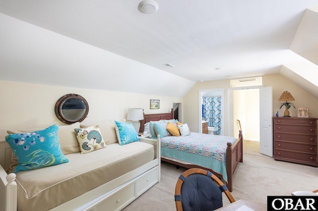830 Hunt Club Dr Lot 387R, Corolla, NC 27927 - bedroom with vaulted ceiling, light carpet, ensuite bathroom, and visible vents