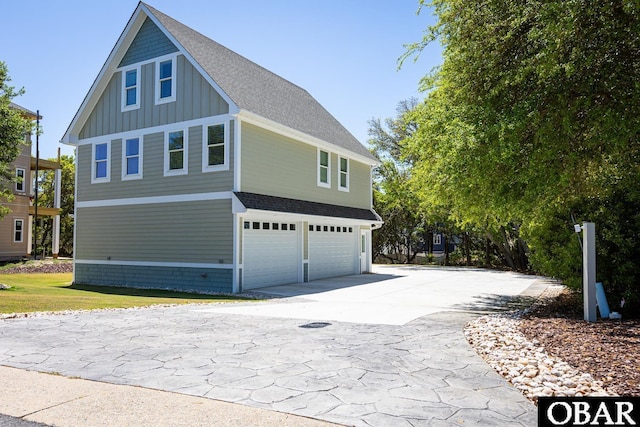 830 Hunt Club Dr Lot 387R, Corolla, NC 27927 - view of side of property with a garage, board and batten siding, driveway, and a shingled roof