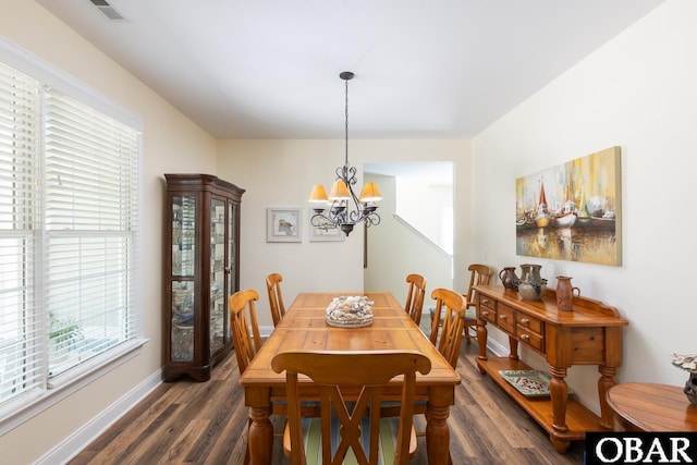 830 Hunt Club Dr Lot 387R, Corolla, NC 27927 - dining area featuring an inviting chandelier, baseboards, dark wood-type flooring, and visible vents