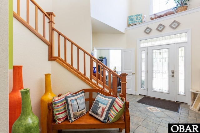830 Hunt Club Dr Lot 387R, Corolla, NC 27927 - entryway featuring stairs, a high ceiling, and a wealth of natural light